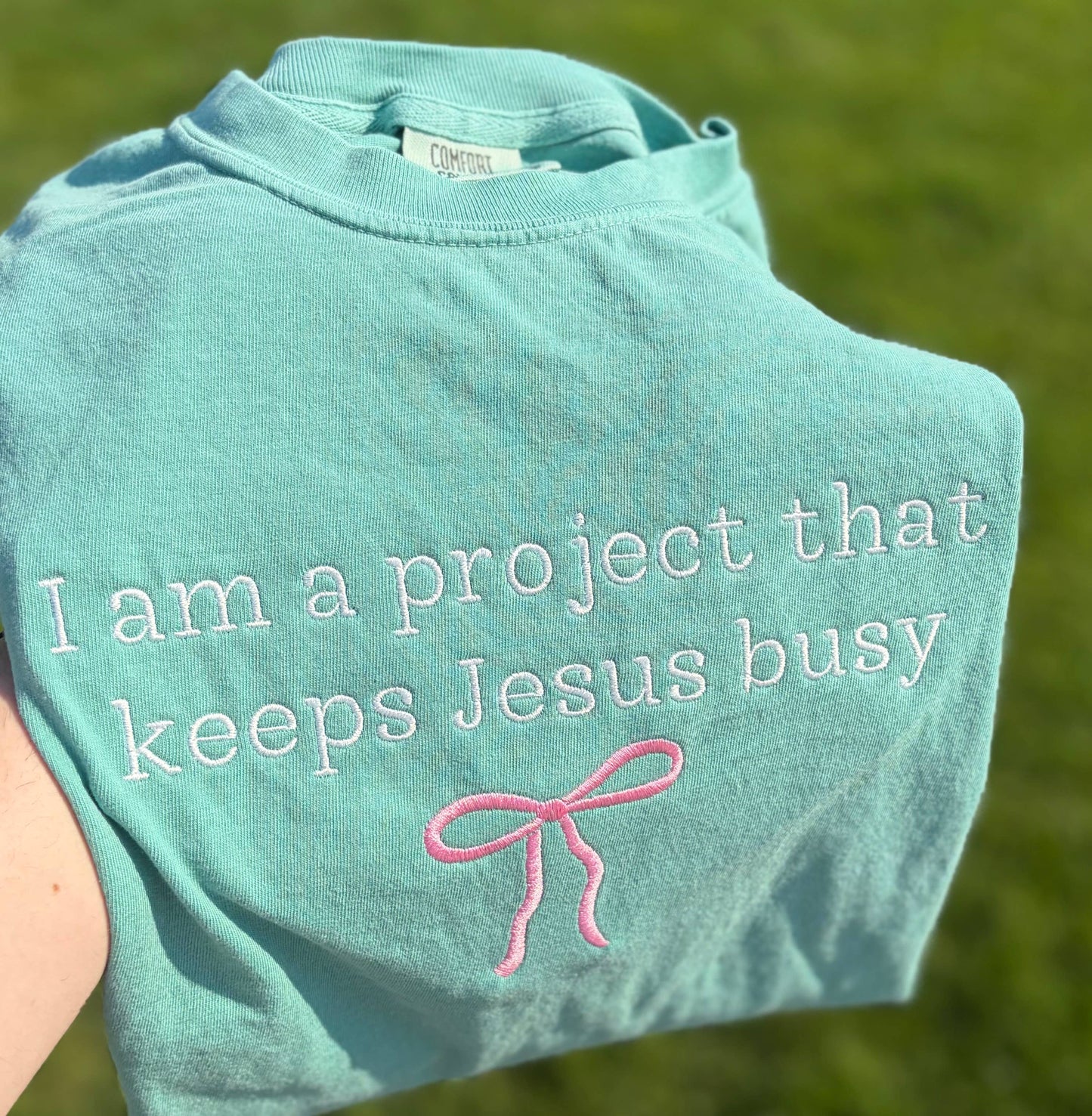 I Am A Project That Keeps Jesus Busy Embroidered CC T-Shirt