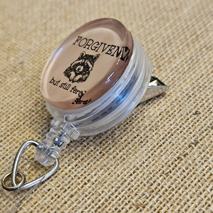 Forgiven But Still Feral Raccoon Badge Reel – Funny Retractable Nurse ID Holder, Acrylic Swivel Badge Clip for Healthcare Workers