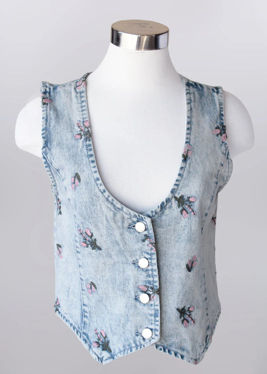 Floral embroidered light wash denim vest made from 100% cotton, styled as a lightweight layering piece for spring outfits