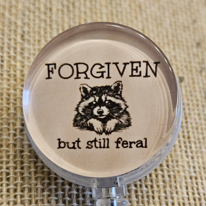 Forgiven But Still Feral Raccoon Badge Reel – Funny Retractable Nurse ID Holder, Acrylic Swivel Badge Clip for Healthcare Workers
