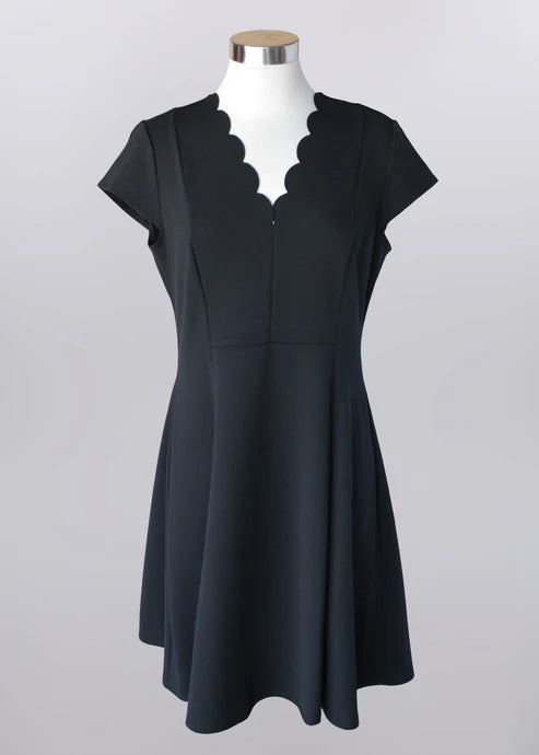 Black dress with scalloped V-neckline, soft stretch fabric, elegant style suitable for church, brunch, and special occasions