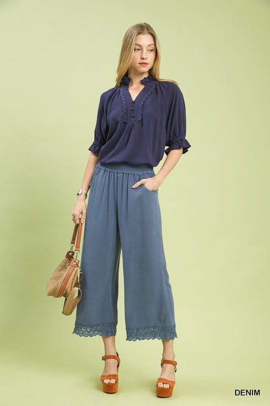 Umgee Denim Blue linen wide-leg pants styled with casual top and sandals, showcasing airy fit and relaxed chic look.