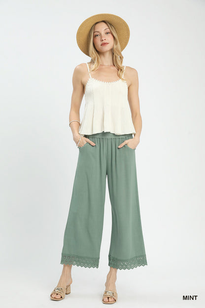 Linen wide-leg pants with elastic waistband and lace trim, made from 55% linen 45% cotton, comfortable and breezy for casual and chic everyday wear