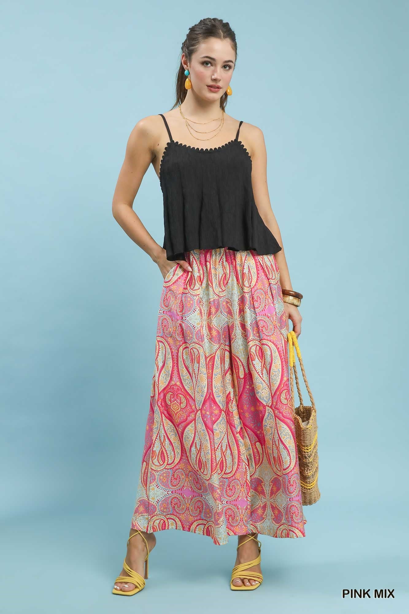 Umgee Pink Printed Pull-On Skirt Pants styled with breezy top, sandals, and sunhat, showcasing flowy wide-leg silhouette for a chic vacation outfit.