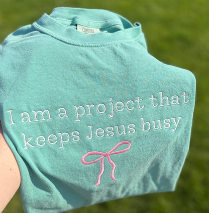 I Am A Project That Keeps Jesus Busy Embroidered CC T-Shirt