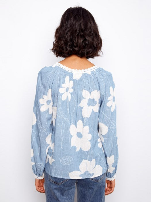 Back view of Charlie B Waterlily printed raglan blouse with crochet detailing, ideal for vacation or weekend outings