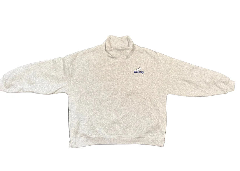 Vintage heather gray Kentucky crewneck sweatshirt with a small embroidered Kentucky logo on the front chest, oversized one-size fit, and large Kentucky lettering on the back.
