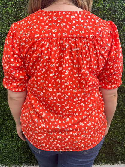 Keren Hart Orange V-neck Top with Floral Print