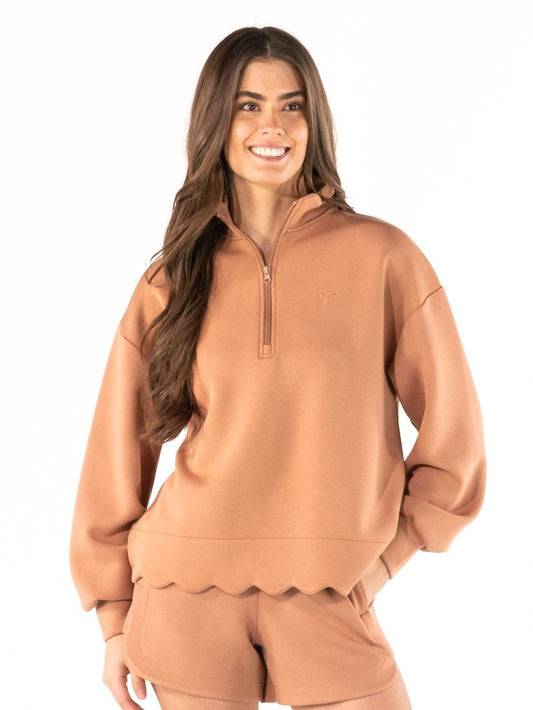 Women's Simply Southern scallop plunge pullover featuring a zip mock neckline, dropped shoulders, full-length sleeves, scalloped trim, and embroidered logo.