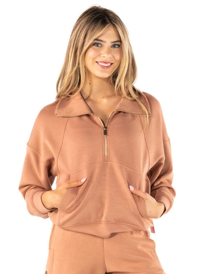Women's mocha half-zip pullover top with mock neckline, raglan long sleeves, and front kangaroo pocket in a relaxed casual style.