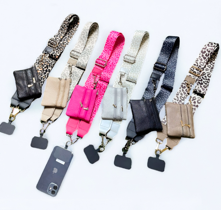 Six different crossbody phone strap bags arranged in a fan shape on a white background. The straps feature various patterns including leopard print, beige animal print, pink leopard print, glittery silver, black leopard print, and solid black, with matching pouches in black, beige, pink, silver, black, and beige.