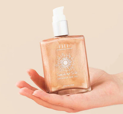 FarmHouse Fresh Sunshine Silk Shimmer Body Oil with rose gold illumination for glowing skin
