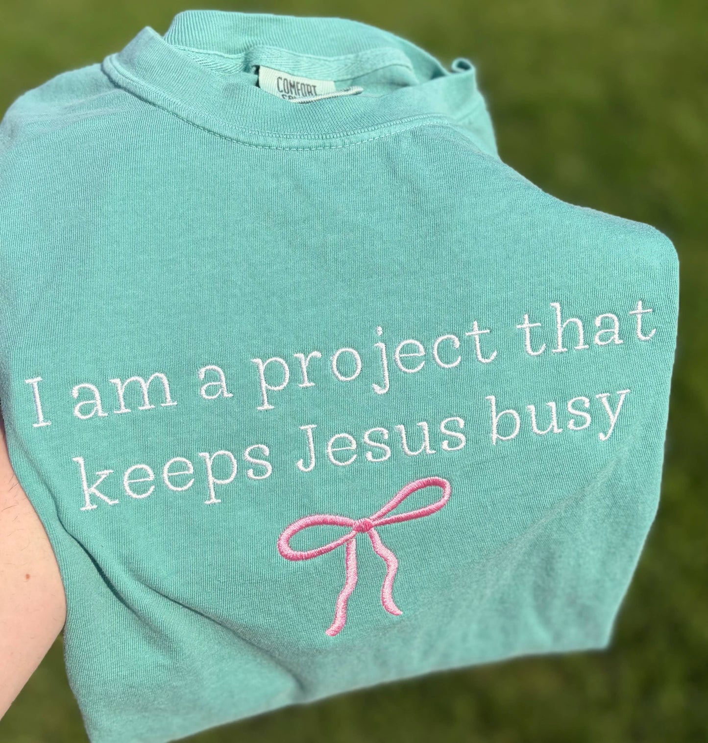 I Am A Project That Keeps Jesus Busy Embroidered CC T-Shirt